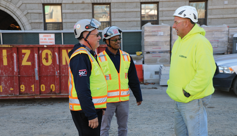 Three LF Driscoll employees wearing safety gear on a jobsite
