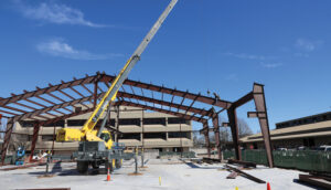 STSW oversaw the construction of the pre-engineered steel building for the Facilities Complex Building 4, beginning with this steel erection.