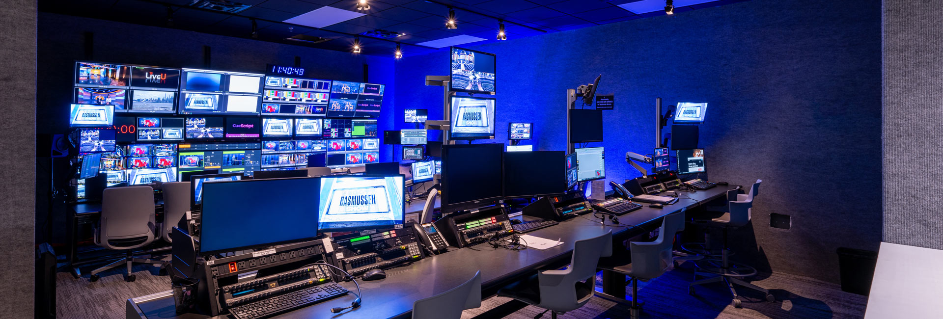 Behind the scenes from live broadcasting with TV monitors and computers.