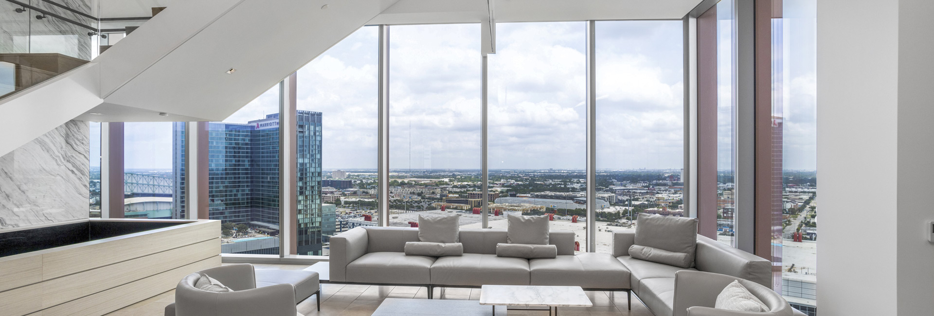 Reception area featuring large windows that showcase a stunning view of the Houston skyline.