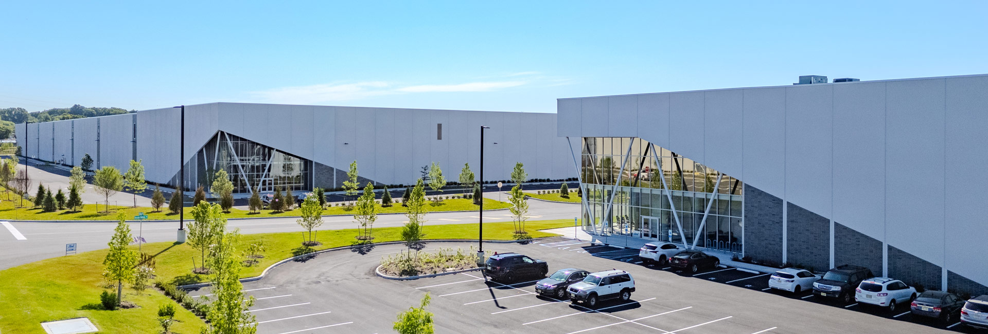 Exterior view of two warehouse/distribution centers.