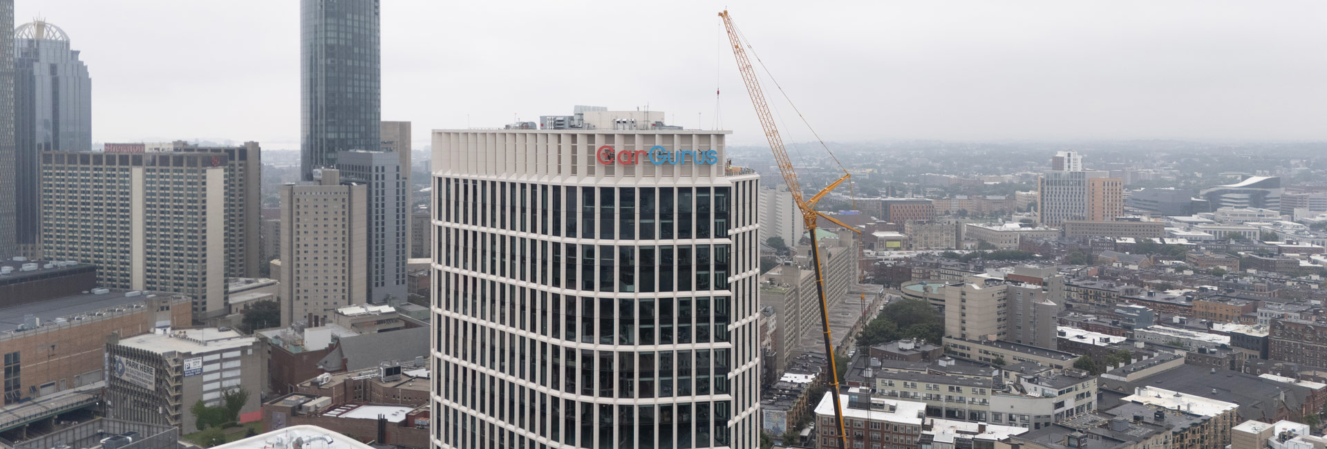 Birdseye view of CarGurus building with a crane.