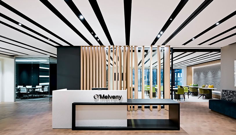 Front desk at O'Melveny Myers with floor to ceiling wood accents.