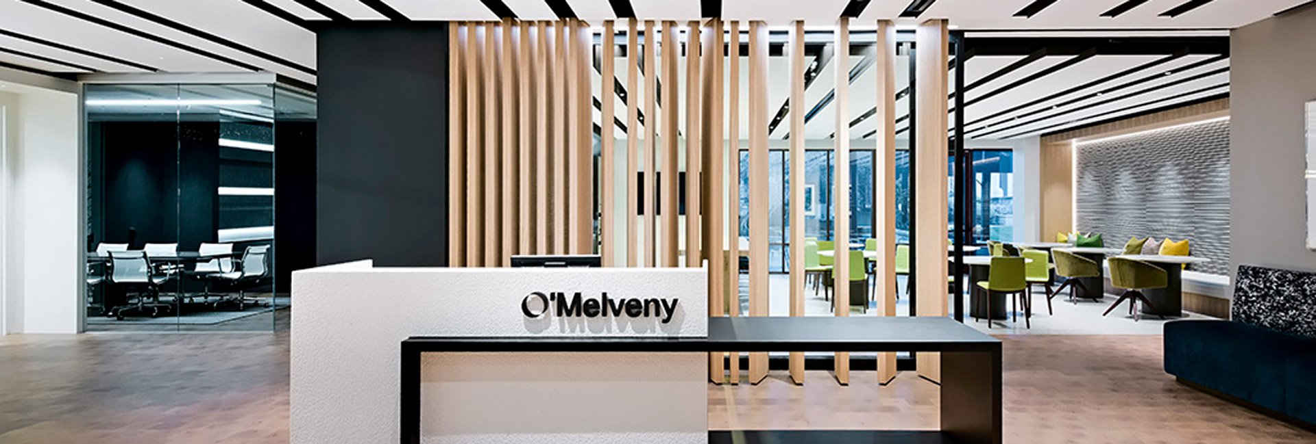 Front desk at O'Melveny Myers with floor to ceiling wood accents.