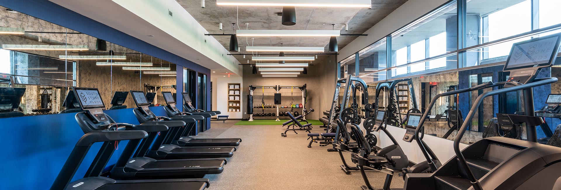 Gym featuring treadmills and other workout equipment