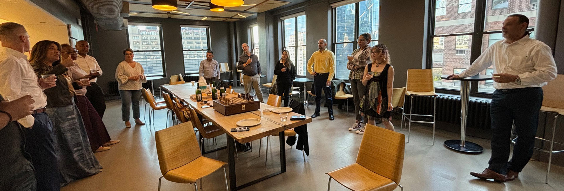 A group of people gathering around a table to celebrate