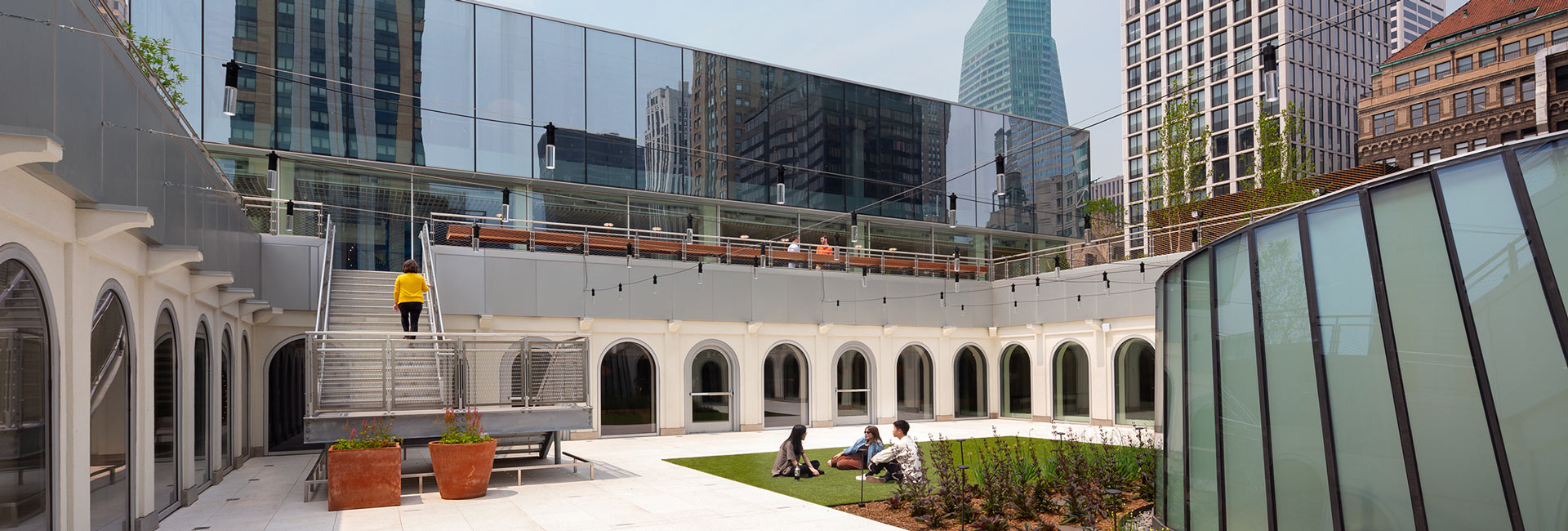 An outdoor space with a grass area for employees to use.