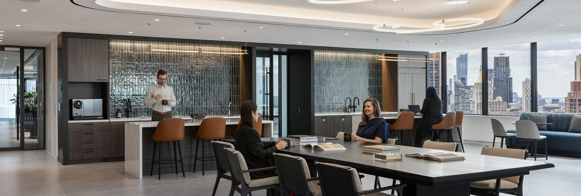 A kitchen area for employees to grab coffee or sit and collaborate with others.