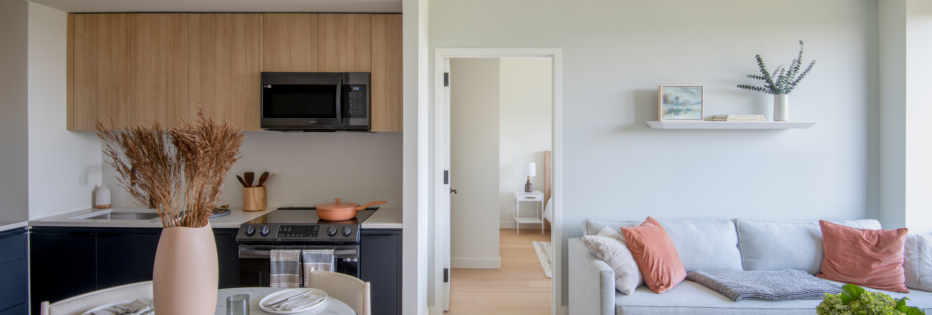 A residential apartment featuring an open kitchen space with a living room