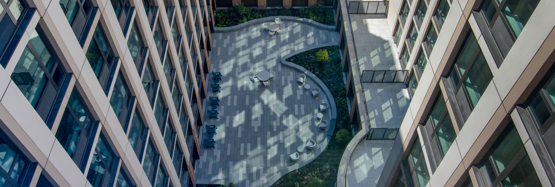 Multi-unit residential complex overlooking the courtyard from above.