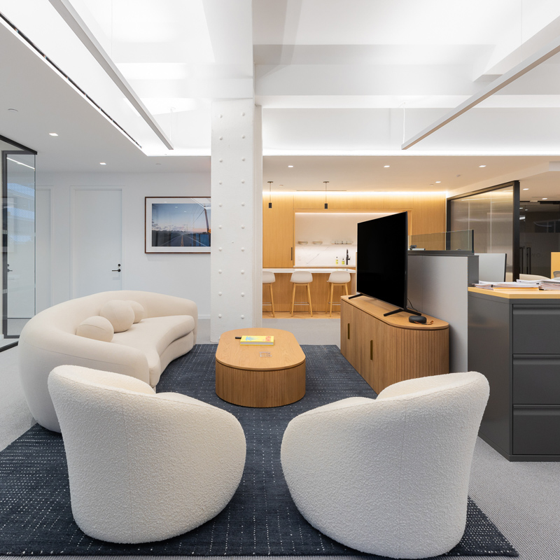 Seating area with couches and a large TV