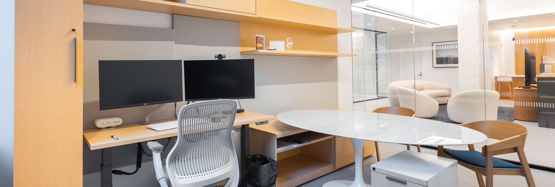 Private office space with a computer and desk area