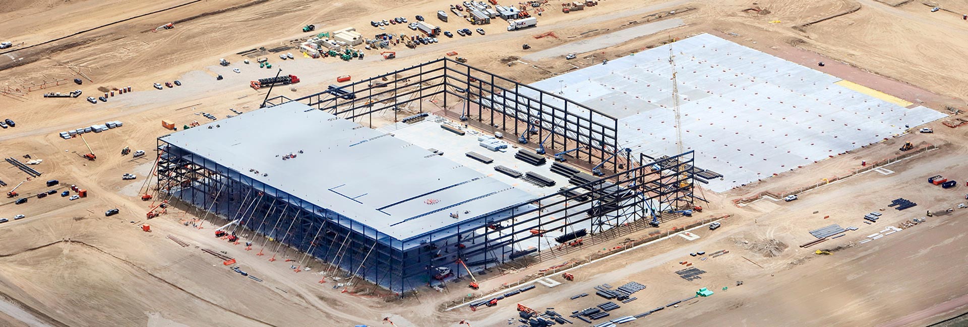 Exterior of an Amazon distribution/warehouse facility being built.