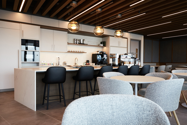 Kitchen area with table seating for employees to enjoy.
