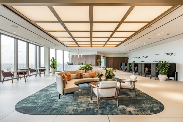 Open office area with couch and chairs for employees to use and collaborate.
