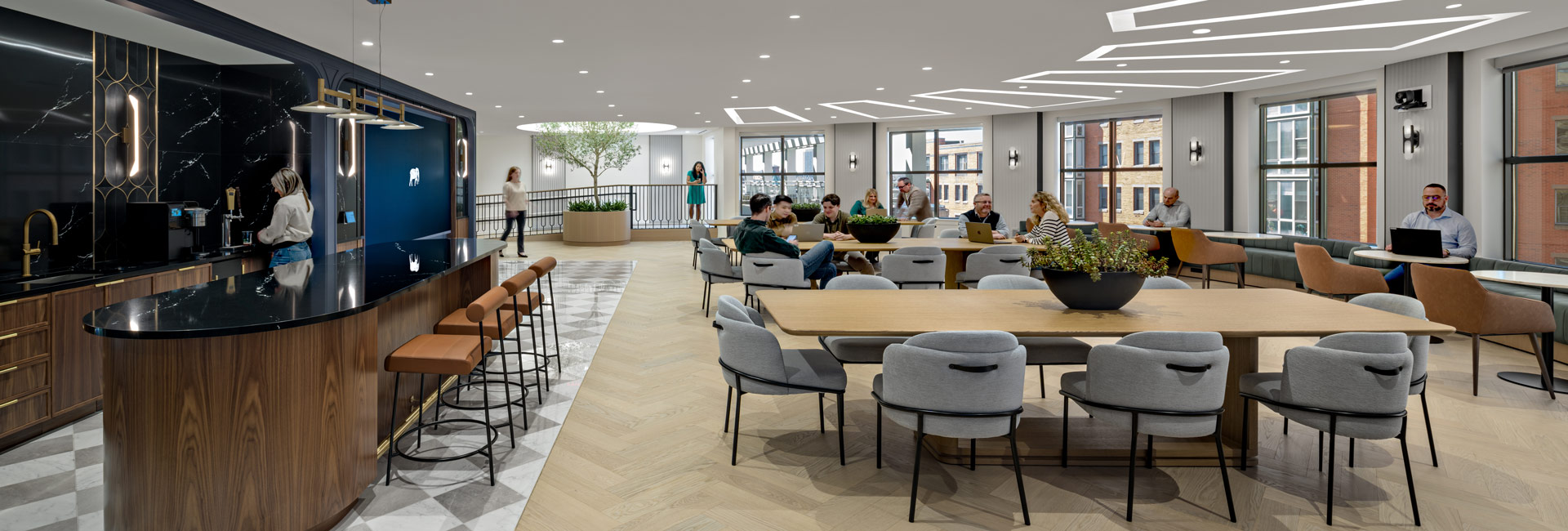 Modern office space featuring a spacious dining area designed for collaboration and social gatherings.