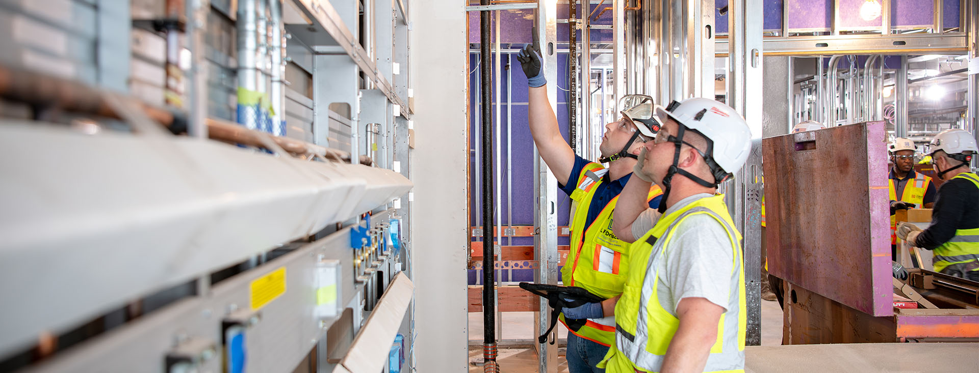 workers looking at pipes