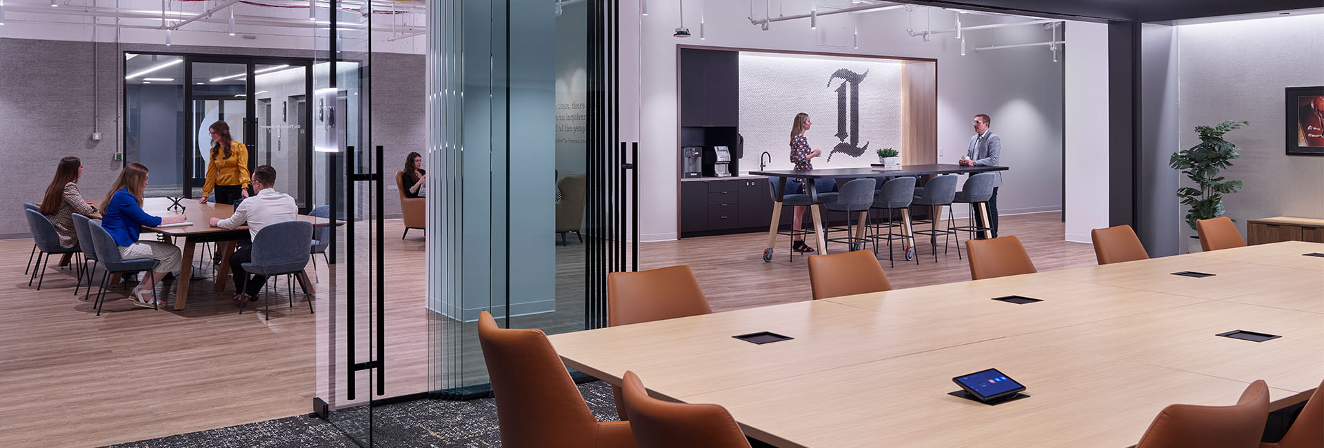 Conference room with large wood table and glass doors at The Philadelphia Inquirer built out by Structure Tone Philadelphia