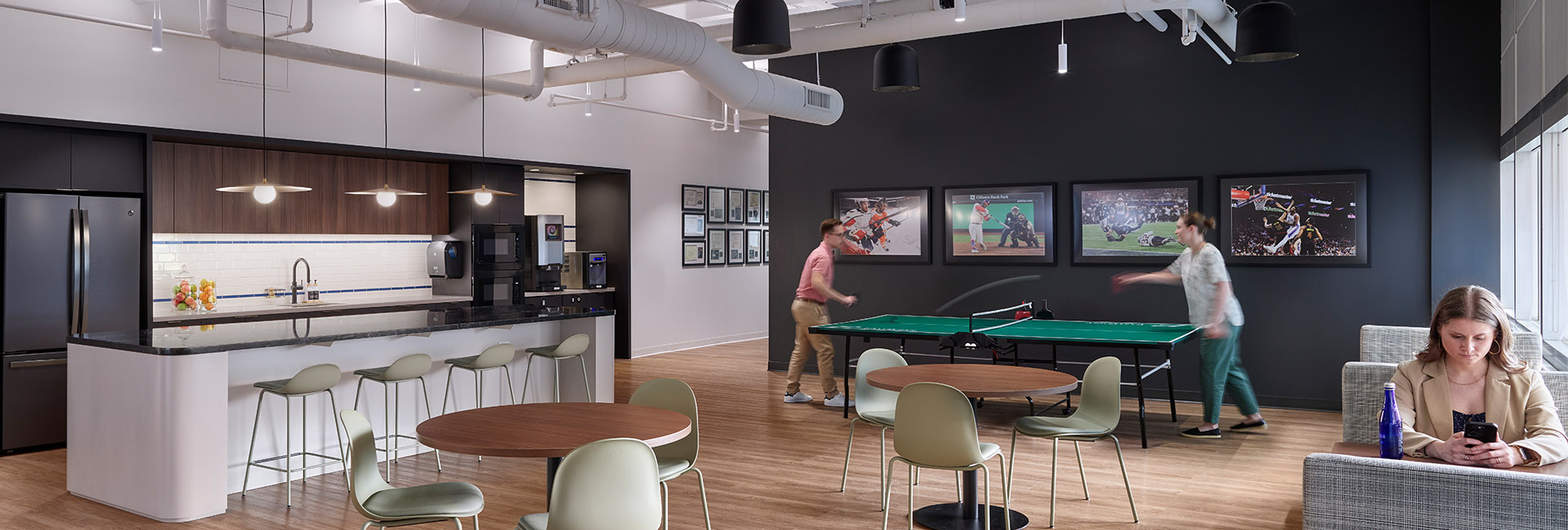 Large modern break room with pool table and kitchen area for The Philadelphia Inquirer built by Structure Tome Philadelphia