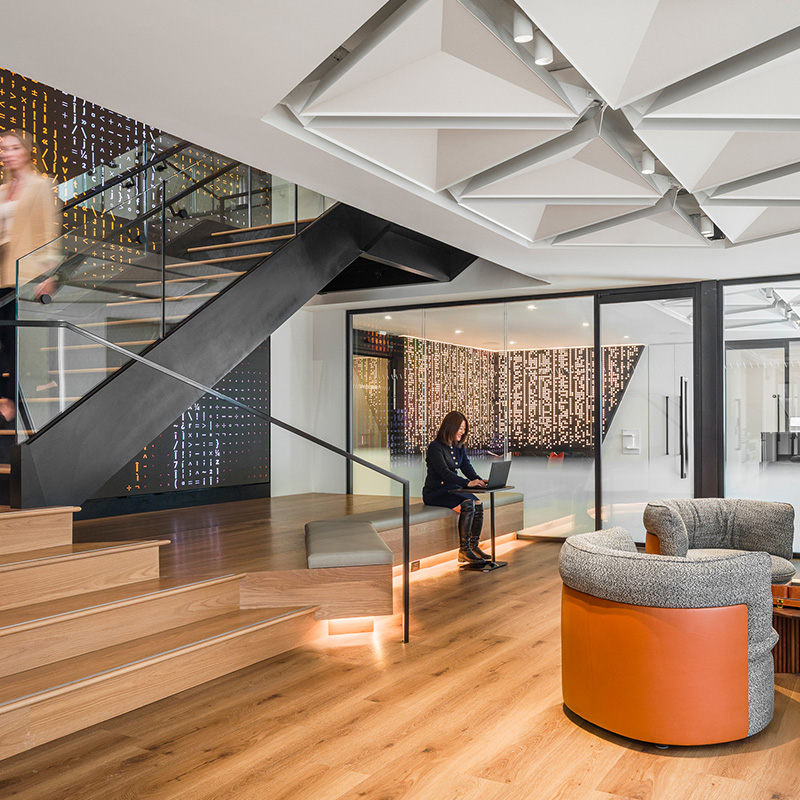 Interior of a office with stairs and a seating area