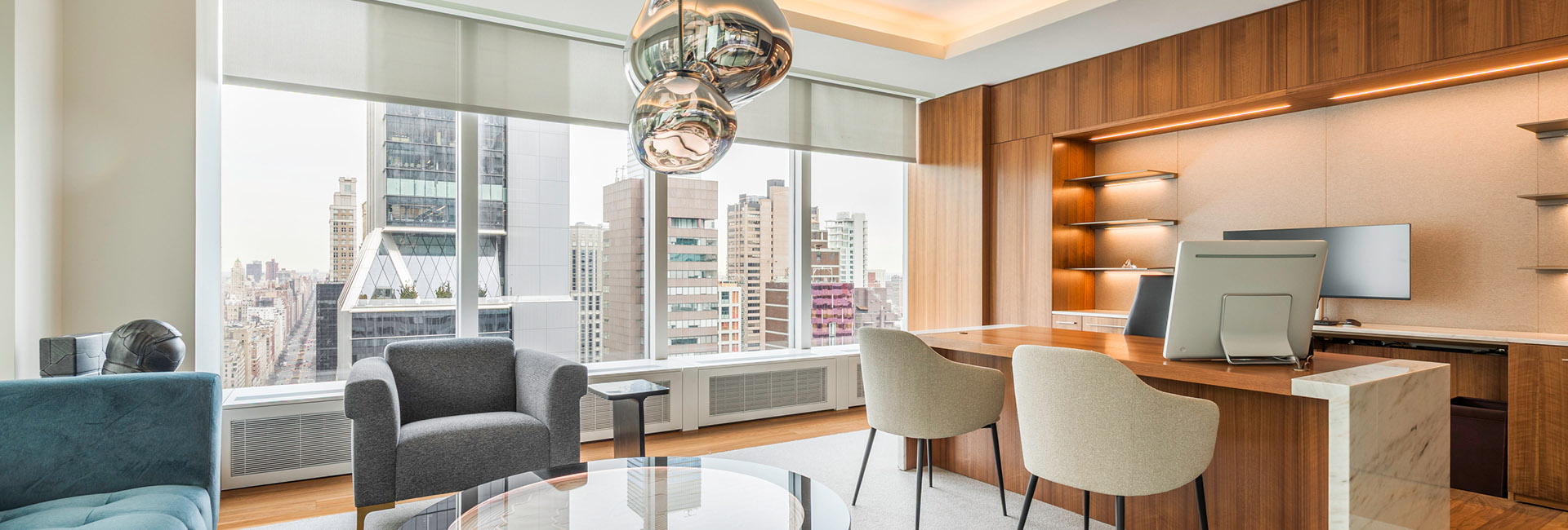 Office room with modern fixtures and wood accent and large wall of windows