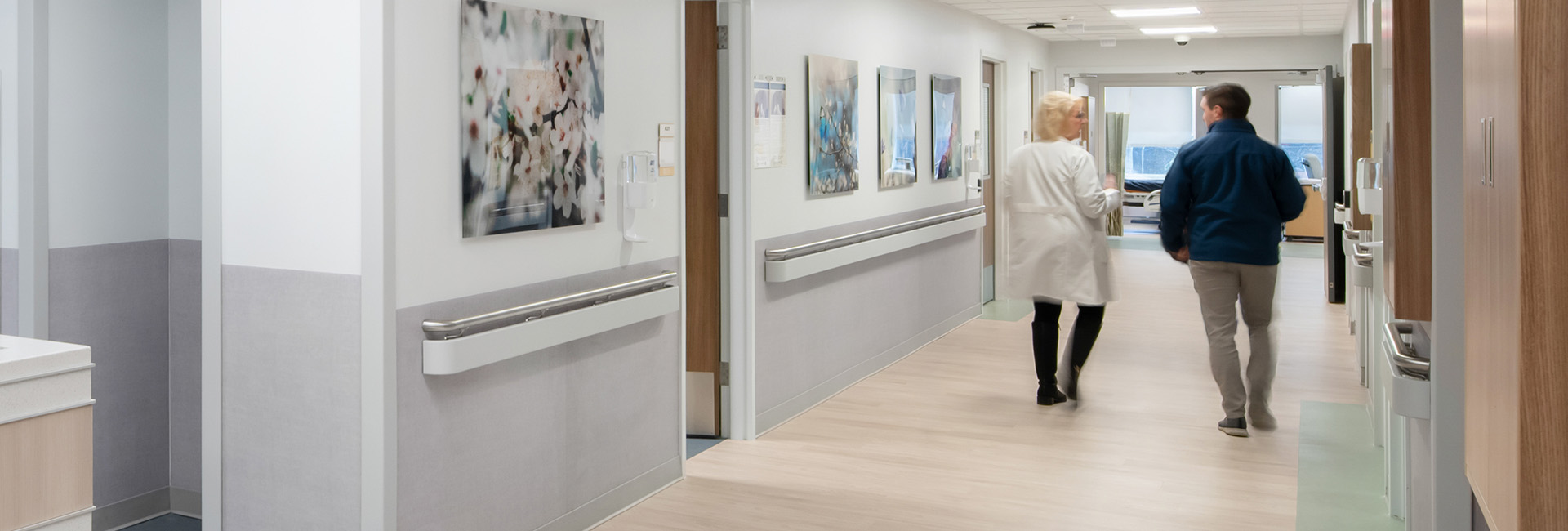 two people walking down a hospital hallway at the Hackensack Meridian Health, Jersey Shore University Medical Center, Ackerman Building additions built by LF Driscoll