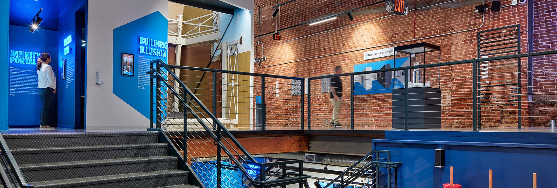 Museum Of Illusions San Diego interior image with steps and walls with images