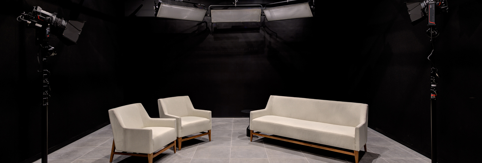 TIAA Corporate Center white couches and interview studio with professional lighting built by Structure Tone Southwest.