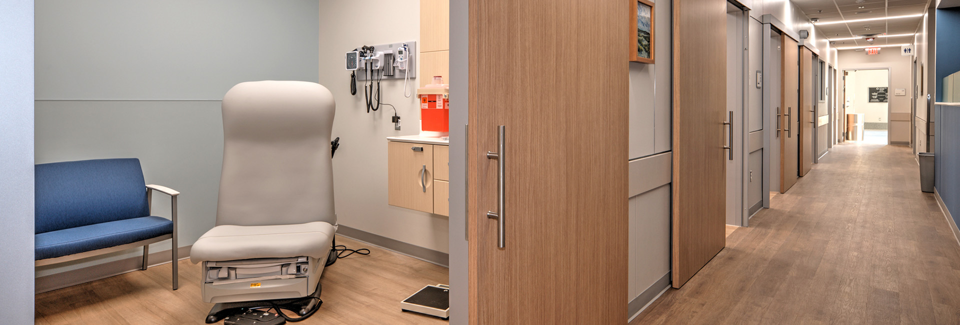 University Health Wheatley image of exam room with blue bench and tan patients chair
