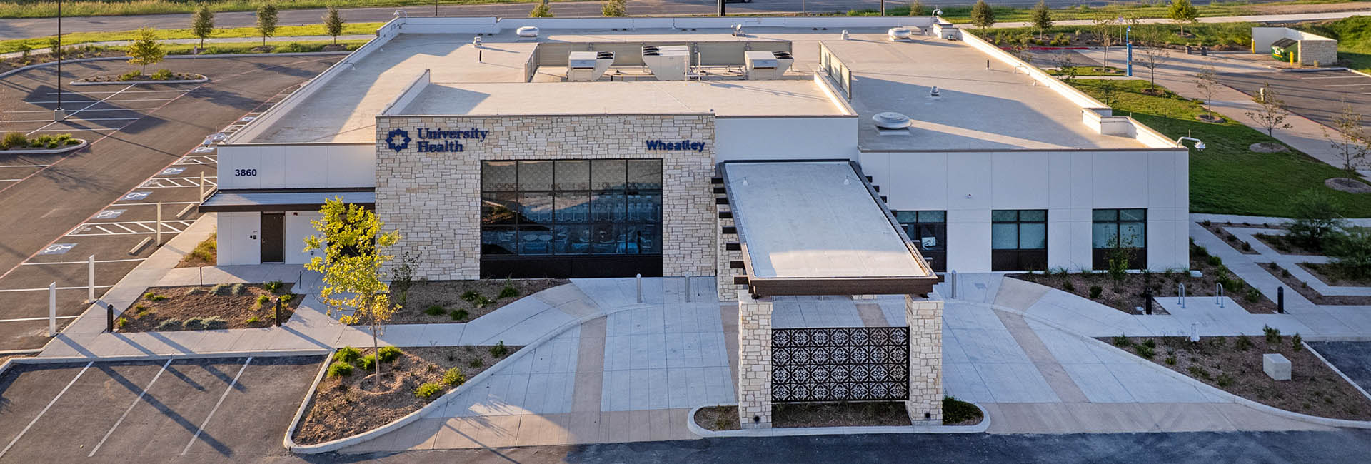 University Health Wheatley areal shot of a white and light tan building with tan stone accent wall VDC & BIM by Structure Tone Southwest