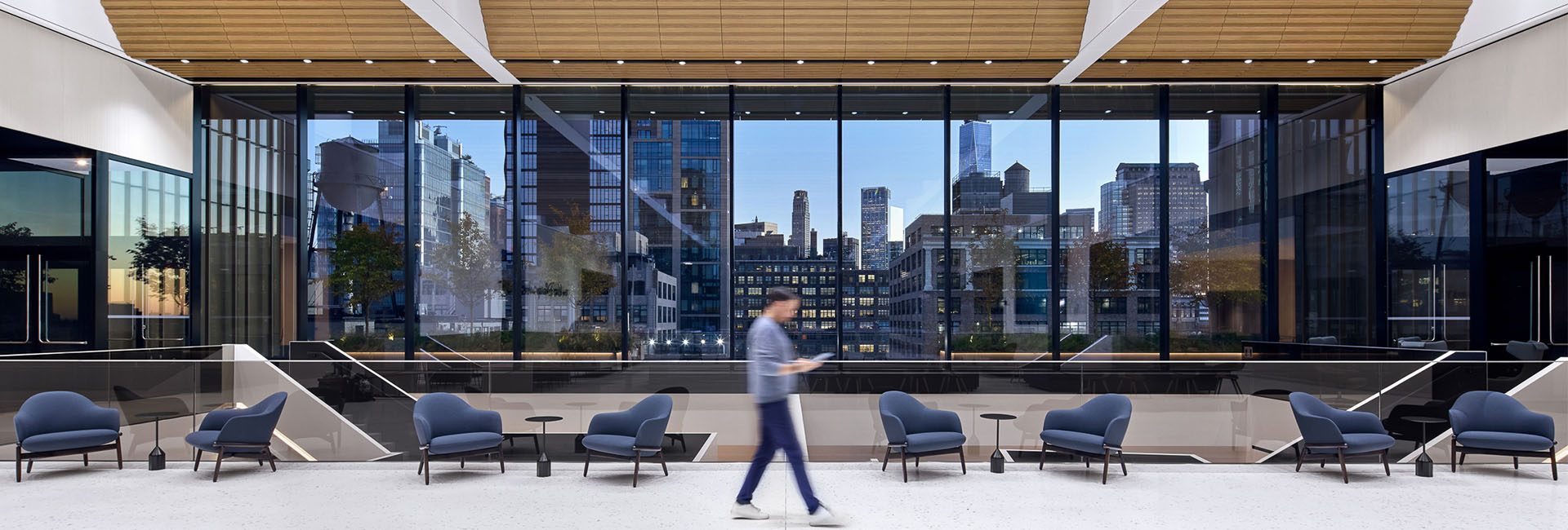 Disney NYC HQ wall of windows and outdoor patio