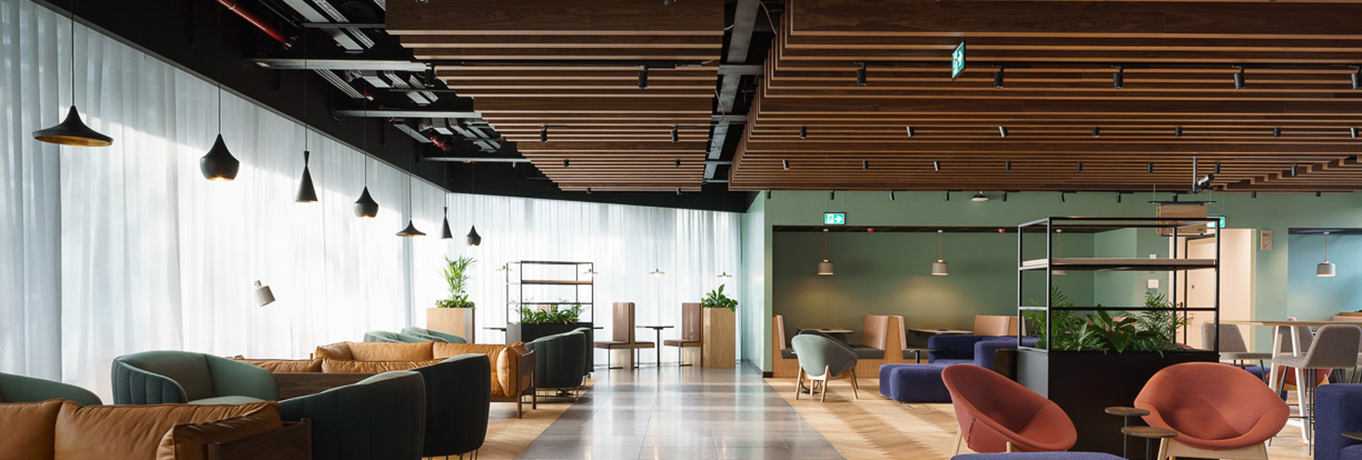 stylish lounge area showcasing bright chairs and tables, creating an inviting atmosphere for gatherings.