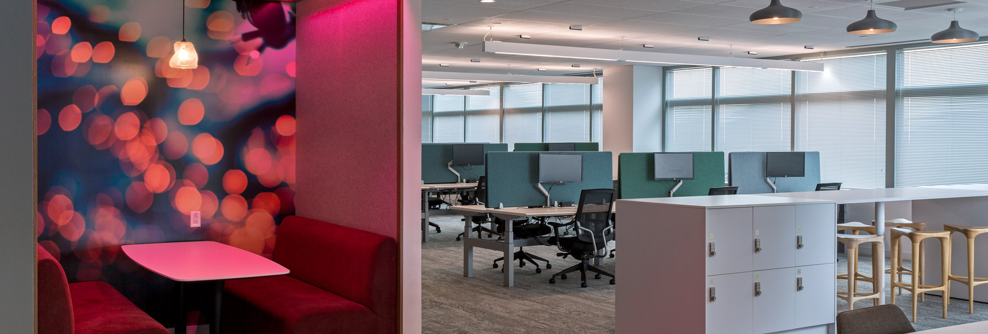 An open area of an office space with cubicles for employees to utilize.
