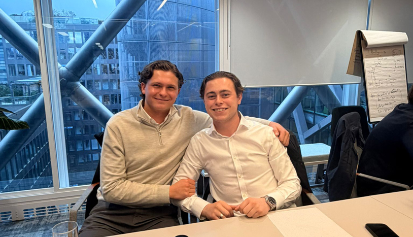 Employees sitting around a conference room table