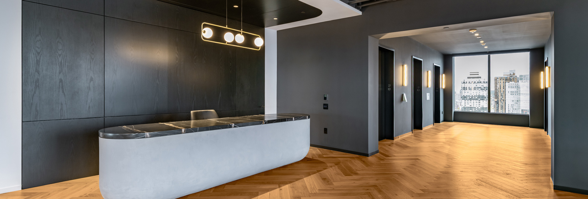 A reception desk next to the elevators