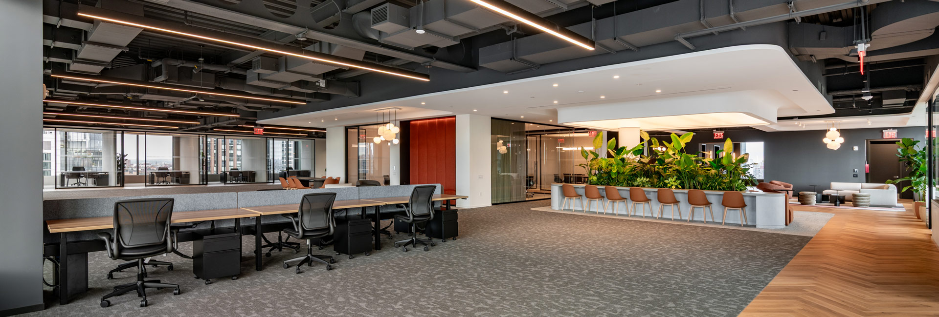 Several desks and chairs for employees to use