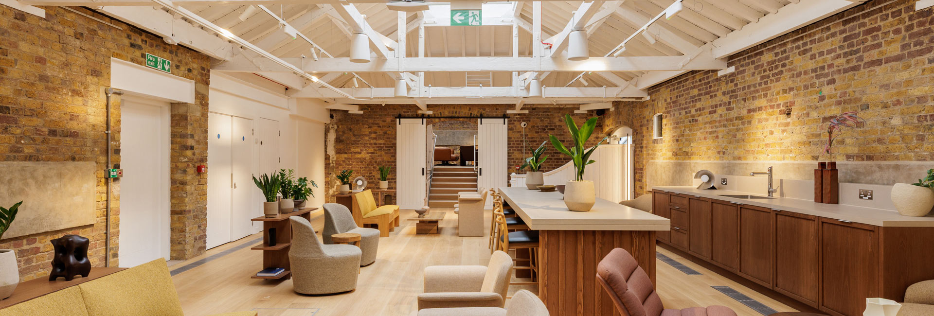 A usable space with a kitchen area, island and lots of seating