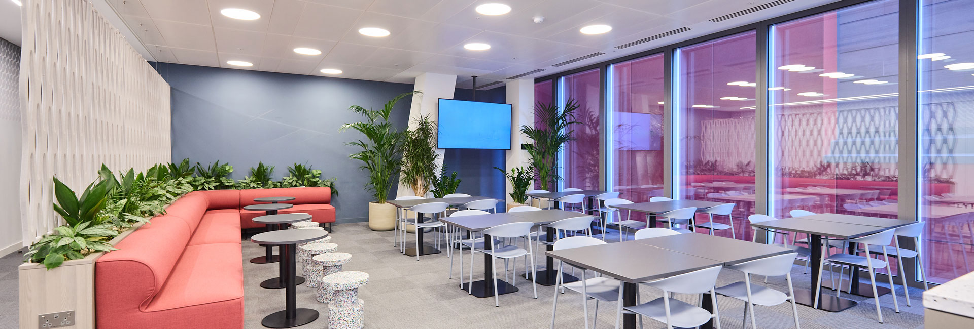 Several tables and chairs within the space