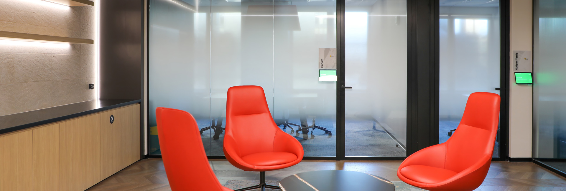 A couple of red chairs in the reception area.
