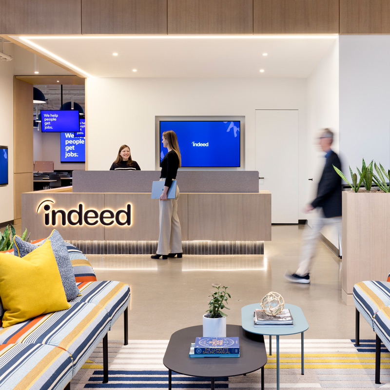 A reception area with a desk and screen