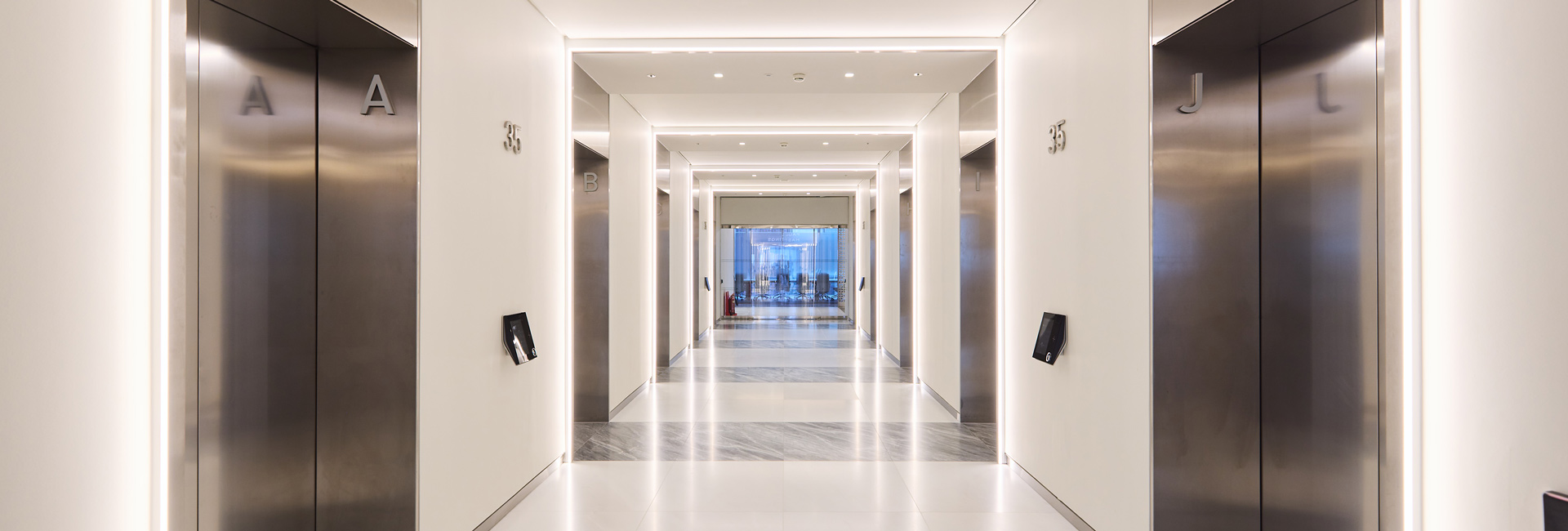 A hallway of elevators
