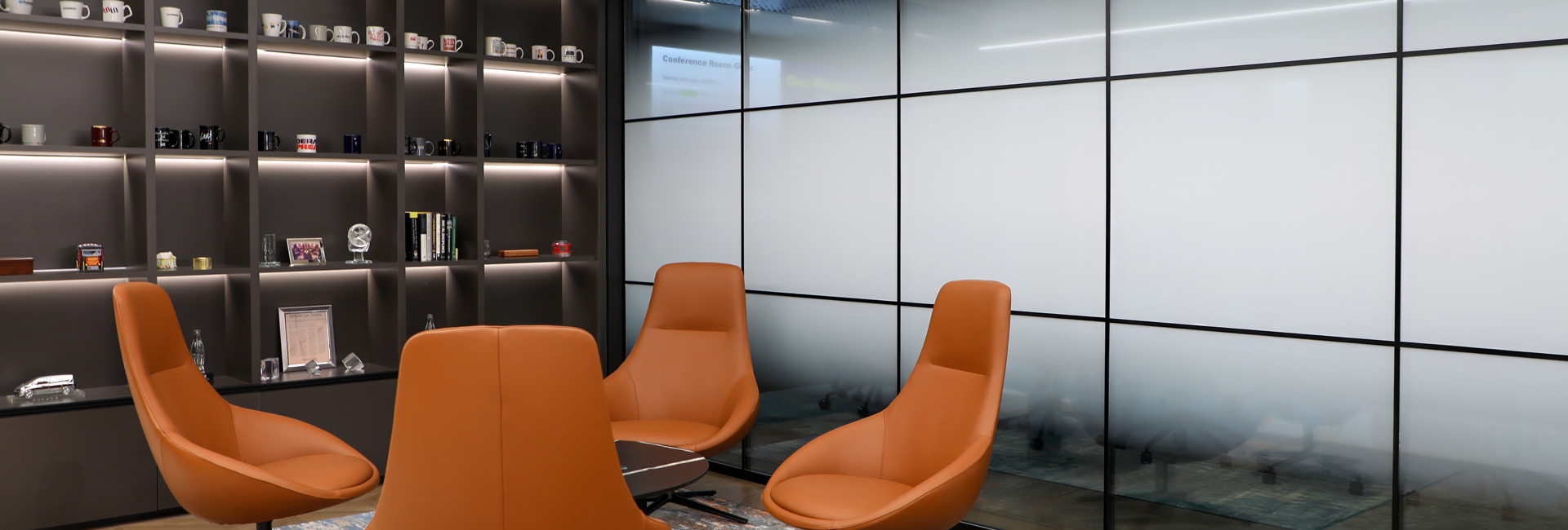 A couple of brown chairs in the reception area.