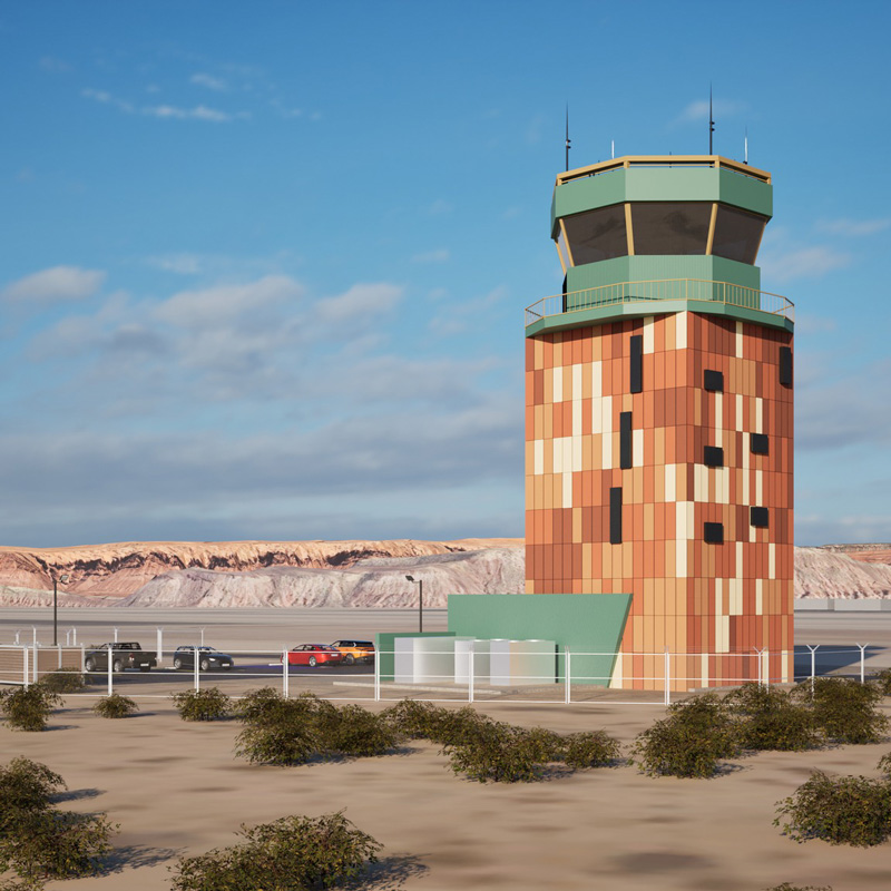 St. George Regional Airport’s colorful air traffic control tower against a backdrop of southern Utah’s red rock landscape.