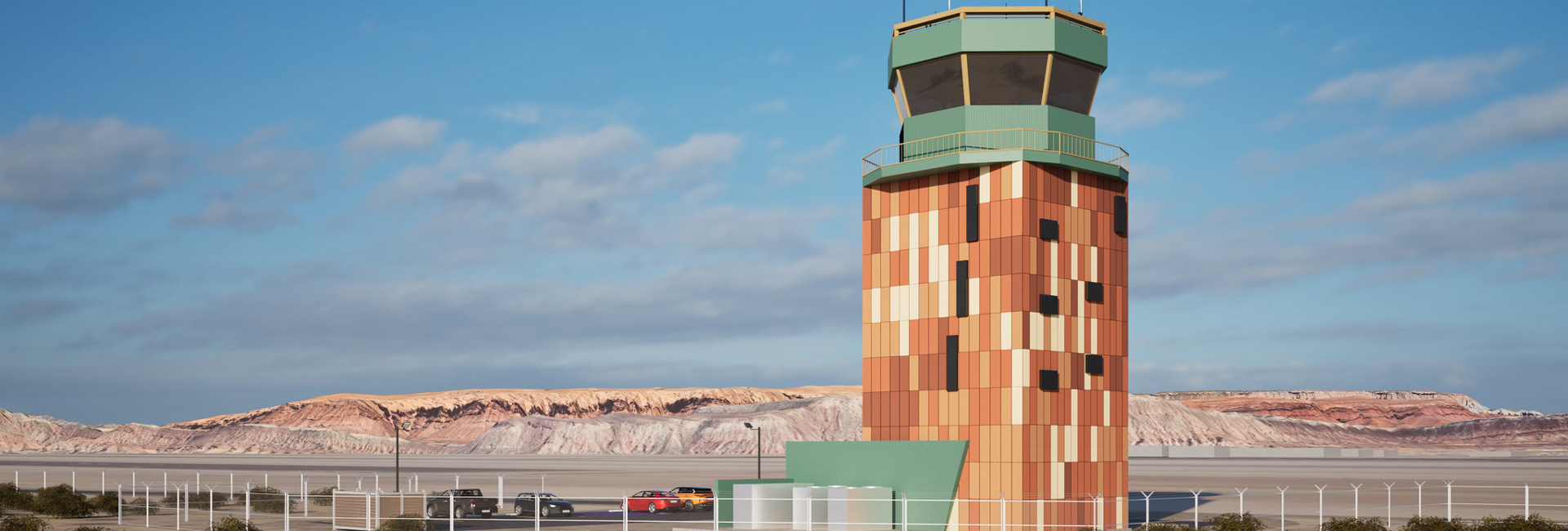 St. George Regional Airport’s colorful air traffic control tower against a backdrop of southern Utah’s red rock landscape.
